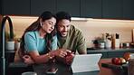 Couple, laughing and online shopping on tablet in kitchen, discussion or scroll on website in house. Purchase, choice and happy people with technology, conversation and bonding on weekend in home