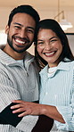 Face, couple and hug in home with smile, bonding together and romantic connection on weekend break. Happy, people and dating in living room with embrace, caring relationship or commitment to partner.