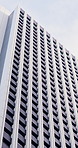 Architecture, windows and building of city skyscraper for corporate headquarters, tower or design. Structure, urban skyline and modern facade outdoor for business district, infrastructure or exterior