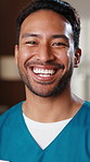 Face, doctor and healthcare with man at hospital, medical professional and integrity as surgeon. Nurse, physician or surgical specialist with ambition, pride and happiness for expert in medicine