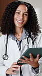 Tablet, woman and face of doctor in hospital with confidence for cardiology career with support. Smile, technology and portrait of surgeon with pride for healthcare service or about us in clinic.