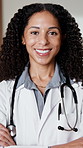 Face, doctor and healthcare with woman at clinic, medical professional and integrity with surgeon. Arms crossed, physician or surgical specialist with ambition, pride and happy expert in medicine