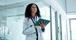 Tablet, thinking and doctor in hospital for medical service, telehealth and appointment schedule. Healthcare, idea and woman on tech for patient record, research and website for insurance in clinic
