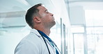Man, doctor and frustrated in clinic with grief, fatigue or doubt with bad news or mistake. Mental health, sad physician and medical person with anxiety for stress, loss or failed surgery in hospital