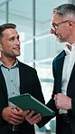 Tablet, talking and business men in office for feedback, finance review and meeting for investment. Corporate, lobby and people on digital tech for discussion, financial advice and budget proposal
