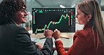 Trading, fist bump or team at desk with computer screen, portfolio growth or success in data review. Happy, people or traders in office with tech, profit milestone or financial gain in stock market.