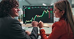 Trading, fist bump or team at desk with computer screen, portfolio growth or victory in data review. Happy, people or trader in agency with tech, profit milestone or financial success in stock market