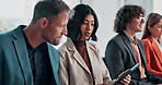 Business, people and tablet in waiting room for interview, application and resume for hiring. Team, candidates and talking in workplace with digital, online cv and recruitment process for onboarding