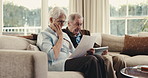 Tablet, document and old couple stress with discussion for bills mistake, error and confused in home. Married, senior people and paperwork on couch with tech, utility expense and doubt for liability.