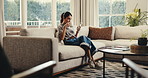 Happy, woman and drinking coffee in house with phone, reading morning news and check blog on weekend. Mature person, smile and relax in living room with tech, tea or mobile app for social media post.