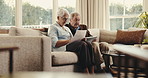 Tablet, document and old couple in home with discussion, review household bills and financial plan. Married, senior people and reading paperwork on sofa with tech, utility expenses or online payment.