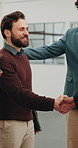 Happy, meeting and team with handshake in office for partnership, b2b or agreement together. People, employees or shaking hands with smile for business introduction, onboarding or deal in workplace