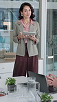 Corporate, woman and speaker in office with tablet, research and discussion for accounting. Person, presentation and team listening with digital, conversation and brainstorming for financial proposal