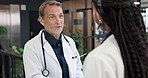 Mentor, man and handshake with doctors in hospital for thank you, healthcare and advice. Medical collaboration, shaking hands and meeting with people in clinic for consulting, help and support