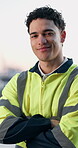 Engineer, face and man with arms crossed, city and confident for career growth on construction site. Happy, portrait and person with building project, civil engineering and property inspection in USA