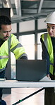 Engineer, team and people with laptop in building, discussion or planning for project with blueprint. Civil engineering, supervisor and colleagues with technology, online and property development