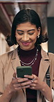 Happy, woman and walk in office with phone, check meeting schedule and reading work email in morning. Person, smile and typing in business with tech, review online calendar and text message for job.