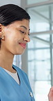 Nurse, smile and woman with tablet in hospital, medical research and reading patient history on web. Healthcare professional, flare and happy person with tech, scroll and treatment plan in clinic