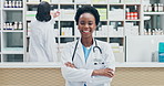 Doctor, face and happy woman with pride in pharmacy for medical dispensary or healthcare service. Portrait, female person or pharmacist with smile, confidence or arms crossed in pharmaceutical store