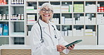 Face, doctor and mature happy woman with tablet in pharmacy for medical dispensary or healthcare. Portrait, female person or pharmacist with smile, technology or pride for pharmaceuticals in store