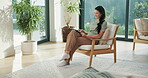 Ebook, happy and woman in house with tablet, calm activity and browse on storytelling platform. Smile, chill and person in living room with tech, literature app and portable reading in peaceful hobby