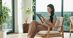Ebook, happy and woman in home with tablet, calm activity and browse on storytelling platform. Smile, chill and person in living room with tech, literature site and portable reading in peaceful hobby