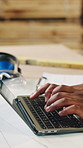 Carpenter, hands or typing with laptop in workshop for freight schedule, stock or distribution. Employee, artisan or furniture designer with computer for wood production or supply chain in warehouse