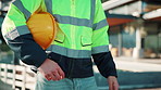Man, hands and construction outdoor with helmet for home renovation, protection or safety compliance. Builder, person and PPE by house for injury prevention, property development or building project.