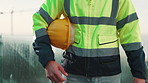 Man, hands and construction worker outdoor with helmet, remodeling project or safety rule compliance. Person, PPE and hard hat on balcony with building site, infrastructure and injury prevention.