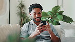 Happy, man and typing with phone on couch for social media, reading blog or online dating app. Networking, email and subscription with person in living room of home for website, sign up and relax