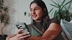 Phone, thinking and typing with happy woman on sofa in home living room for social media browsing. App, connectivity and networking with mobile user in apartment for text message contemplation