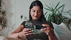 Shopping online, phone and happy woman with credit card in home, ecommerce or transaction on website. Digital payment, smile and person with mobile app, typing and purchase with discount in house