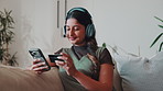 Ecommerce, phone and happy woman with credit card in home, online shopping or relax with headphones. Digital, payment and person with mobile, smile and listen to music in lounge and purchase in house