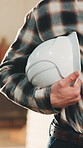 Helmet, man and hands of woodworker in workshop for furniture manufacturing or timber production. Hard hat, PPE and carpenter with safety compliance for protection of lumber project in factory.