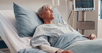 Medical, recovery and thinking with woman in hospital bed for monitoring, oxygen or treatment. Breathing tubes, healthcare and reflection with mature patient in clinic for post surgery contemplation