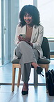 Job search, online and businesswoman with phone in waiting room, onboarding or chatting with contact. Typing, message and happy person with mobile, hiring process and planning for interview in office
