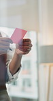 Hands, sticky note and business woman in office with planning for project, ideas and news article. Media agency, creative and person with inspiration for glass wall, editing report and submission