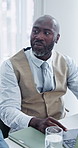 Meeting, review or black man in office with laptop, forecast or growth plan in budget track. Talking, tech or mature finance advisor with proposal, profit outlook or feedback on revenue projection.