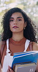 University, face or woman in park with books, knowledge or scholarship in business course. Education, portrait or college student with textbook, confidence or academic growth in economics curriculum
