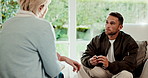 Discussion, psychology and man with therapist in office for support, advice or consultation. Talking, guide and patient with psychiatrist for counseling session on mental health evaluation in clinic