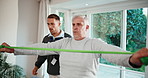 Physiotherapy, support and senior man with resistance band, physiotherapist and talking for advice. Physio, healthcare and wellness with old patient at clinic for stretching, muscle and injury
