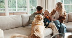 Happy, parents and baby at house with dog, love and parental support for bonding together. Smile, people and toddler on sofa with pet animal, nuturing childcare and playing with toy for weekend break