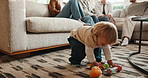 Problem solving, toy and walking with baby boy in home living room for motor skills development. Future, growth and steps with excited child in apartment for balance, coordination or movement