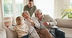 Family, clapping and child with phone in lounge, entertainment or watching cartoons on social media. Streaming, movie and toddler with mobile in house, happy people and grandparents in living room