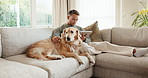 Tablet, calm and man with dog on sofa in home for research on pet adoption, foster care or wellness. Relax, digital technology and person reading blog on app for animal health in house with puppy.