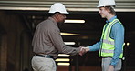 Men, inspector or architect with handshake in warehouse for building agreement or construction deal. Male people, contractor or civil engineer shaking hands for meeting, inspection or partnership