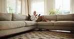 Happy, woman and credit card in home with phone, online shopping or fist pump for sale promotion. Excited, mature person and digital banking on sofa with tech, app and celebration for ecommerce deal.
