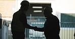 Men, architect or silhouette with handshake in warehouse for building agreement or meeting together. Male people, contractor or civil engineer shaking hands with coworker for construction or deal