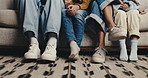 Legs, family and wait on sofa for bonding together, kids and parents on break with connection in house. Shoes, children and people on couch in living room for relax, love and comfort in home lounge