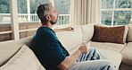 Relax, thinking and man in house with coffee, calm mindset and daydreaming on weekend break. Reflection, nostalgia and mature person with warm drink, mindfulness and peaceful perspective in lounge.